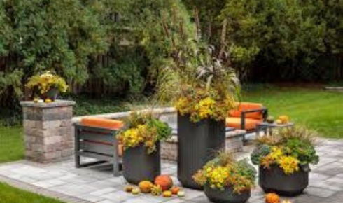 How can putting heavier pots at the back and lighter ones at the front make plant care simpler