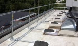 How can seeing whether access ladders and stairs to the roof are well-lit add to building safety