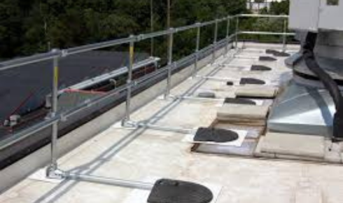 How can seeing whether access ladders and stairs to the roof are well-lit add to building safety